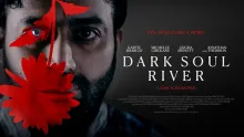 A man with a red flower in front of his face with the words Dark Soul River