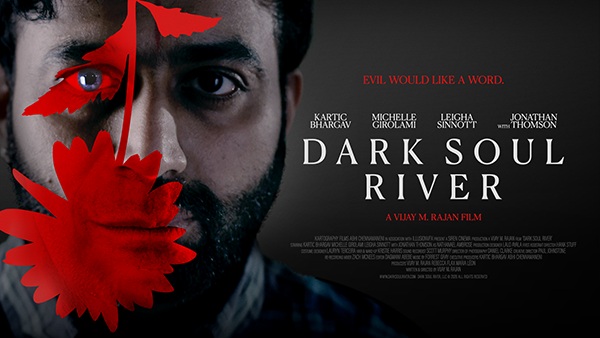 A man with a red flower in front of his face with the words Dark Soul River